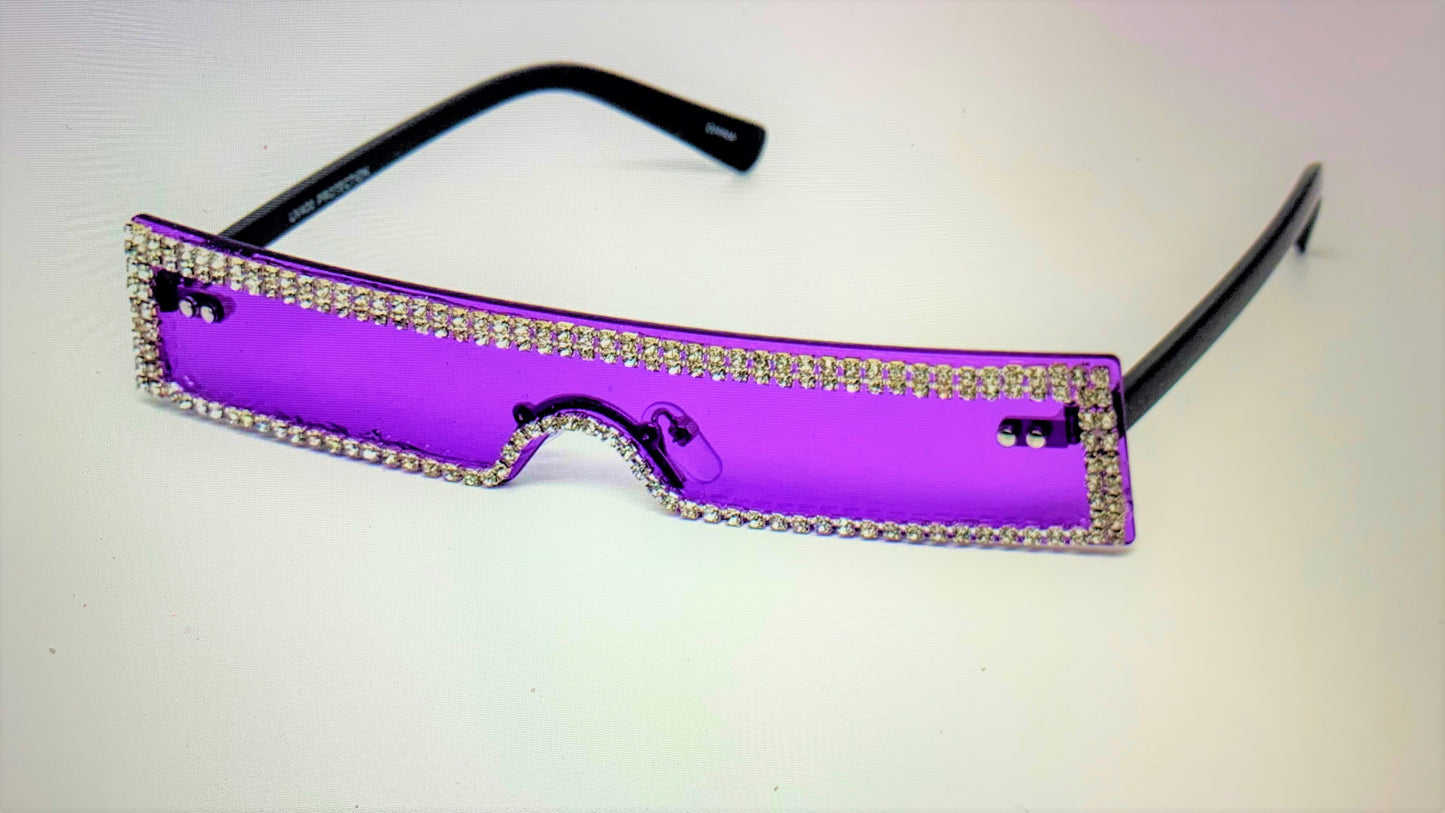 Wait a minute, don't forget the high fashion rhinestone slim color sunglasses.  The sunglasses has a thin high fashion cyber retro rectangular design with rhinestones infused borders and flexible acrylic frames.  They're screaming, SOPHISTICATED LADY! 