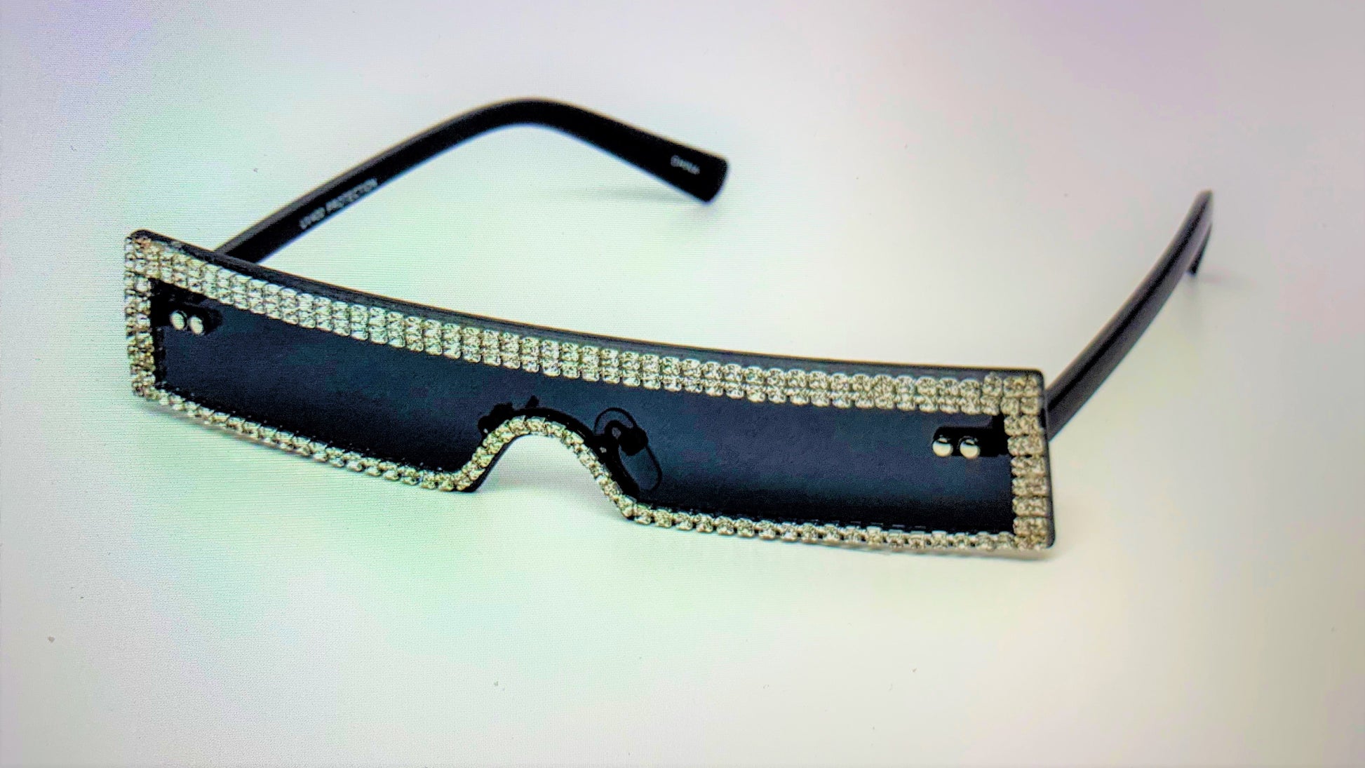 Wait a minute, don't forget the high fashion rhinestone slim color sunglasses.  The sunglasses has a thin high fashion cyber retro rectangular design with rhinestones infused borders and flexible acrylic frames.  They're screaming, SOPHISTICATED LADY! 